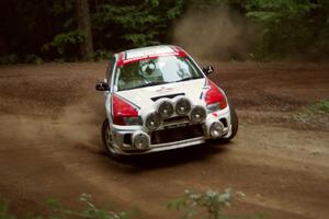 Garen Shrader / Doc Schrader Mitsubishi Lancer Evo IV powers out of a hairpin on SS5, Thompson Point I.