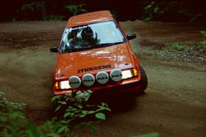 Gail Truess / Pattie Hughes Mazda 323GTX powers out of a hairpin on SS5, Thompson Point I.