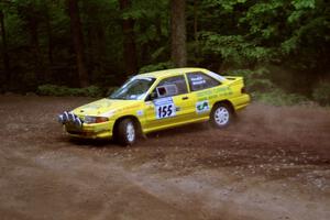 Padraig Purcell / Patrick McGrath Ford Escort GT at a hairpin on SS5, Thompson Point I.