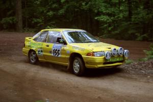 Padraig Purcell / Patrick McGrath Ford Escort GT powers out of a hairpin on SS5, Thompson Point I.