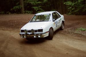 Henry Krolikowski / Cindy Krolikowski Dodge Shadow powers out of a hairpin on SS5, Thompson Point I.