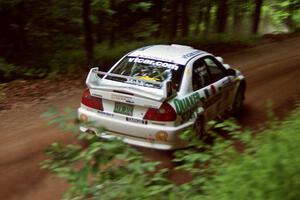Gabriel Marin-Ortiz / Mark Williams Mitsubishi Lancer Evo V powers out of a hairpin on SS5, Thompson Point I.