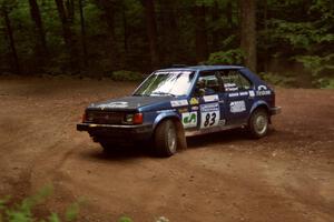 Mark Utecht / Diane Sargent Dodge Omni GLH-Turbo at a hairpin on SS5, Thompson Point I.