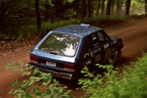 Mark Utecht / Diane Sargent Dodge Omni GLH-Turbo powers out of a hairpin on SS5, Thompson Point I.