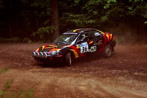 Evan Moen / Tom Young  Plymouth Neon ACR at a hairpin on SS5, Thompson Point I.