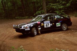 Jay Kowalik / Scott Embree Honda Civic CVT at a hairpin on SS5, Thompson Point I.