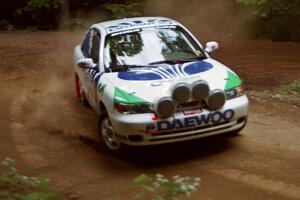 Peter Malaszuk / Darek Szerejko Daewoo Nubira powers out of a hairpin on SS5, Thompson Point I.