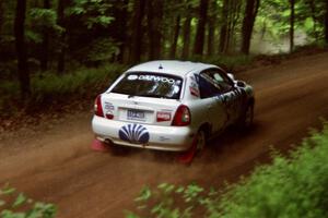 Peter Malaszuk / Darek Szerejko Daewoo Nubira powers out of a hairpin on SS5, Thompson Point I.