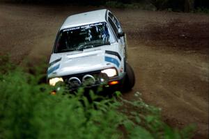 Eric Burmeister / Mark Buskirk VW GTI powers out of a hairpin on SS5, Thompson Point I.