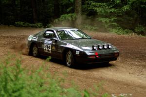 Jens Larsen / Claire Chizma Mazda RX-7 powers out of a hairpin on SS5, Thompson Point I.