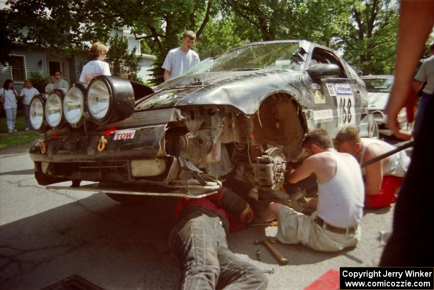 Celsus Donnelly / Brendan Lawless Eagle Talon gets repairs during the midday break on the green in Wellsboro.