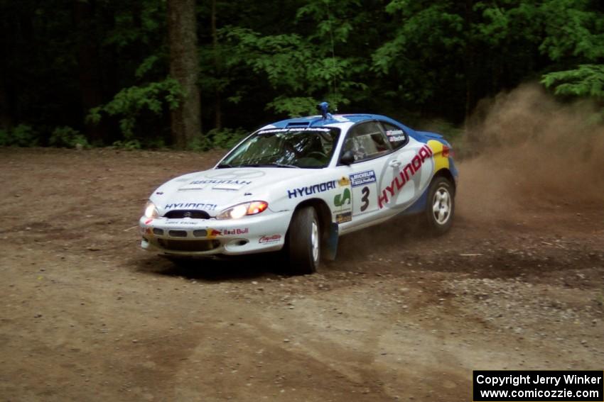 Paul Choiniere / Jeff Becker Hyundai Tiburon slides into a hairpin on SS5, Thompson Point I.