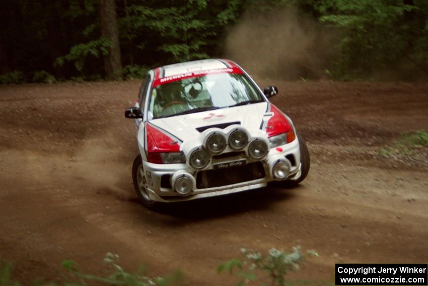 Garen Shrader / Doc Schrader Mitsubishi Lancer Evo IV powers out of a hairpin on SS5, Thompson Point I.