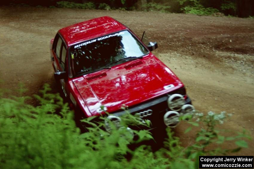 Jon Kemp / Rod Hendricksen Audi 4000 Quattro powers out of a hairpin on SS5, Thompson Point I.