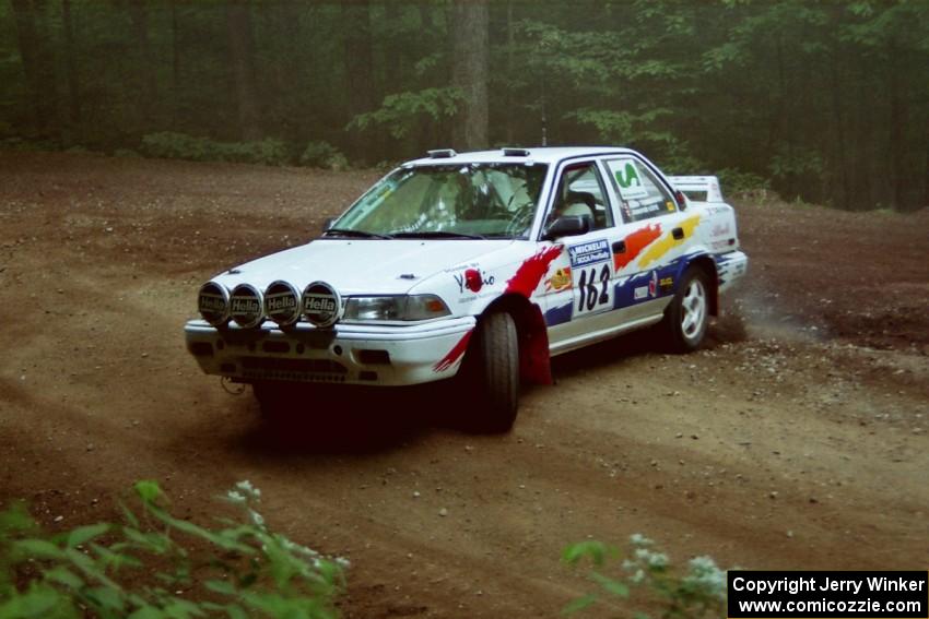 Keith Townsend / Jennifer Cote Toyota Corolla at a hairpin on SS5, Thompson Point I.