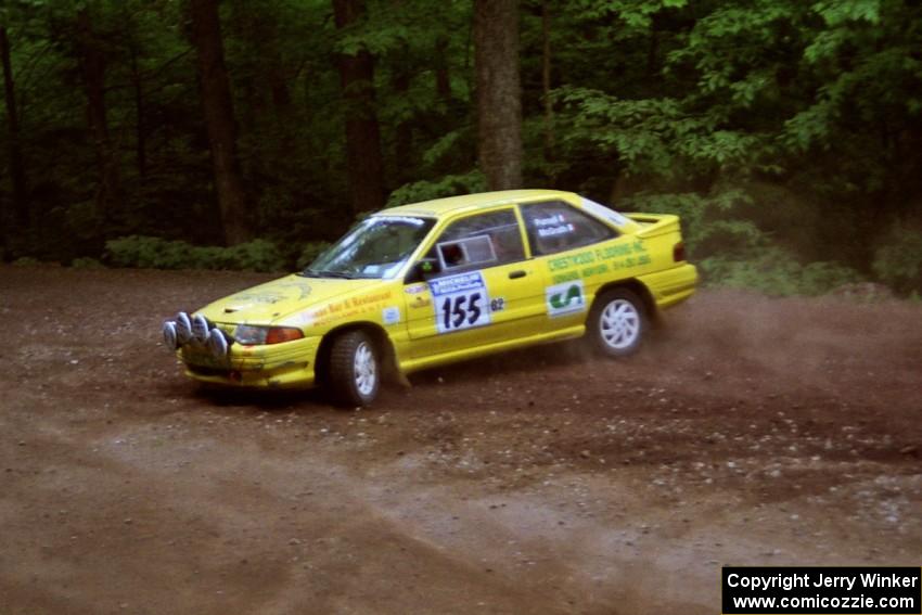 Padraig Purcell / Patrick McGrath Ford Escort GT at a hairpin on SS5, Thompson Point I.