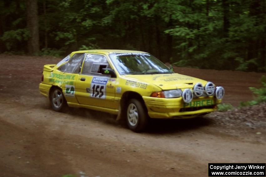 Padraig Purcell / Patrick McGrath Ford Escort GT powers out of a hairpin on SS5, Thompson Point I.