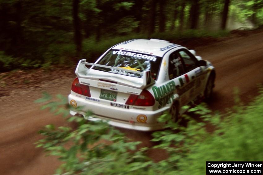 Gabriel Marin-Ortiz / Mark Williams Mitsubishi Lancer Evo V powers out of a hairpin on SS5, Thompson Point I.
