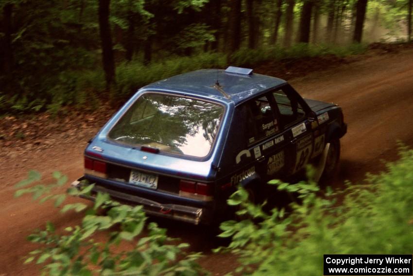 Mark Utecht / Diane Sargent Dodge Omni GLH-Turbo powers out of a hairpin on SS5, Thompson Point I.