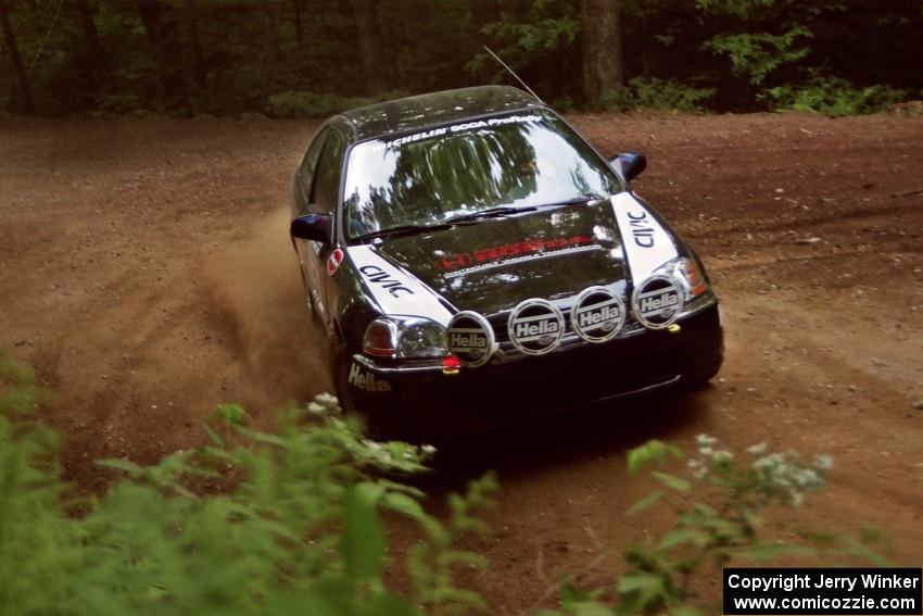 Jay Kowalik / Scott Embree Honda Civic CVT powers out of a hairpin on SS5, Thompson Point I.