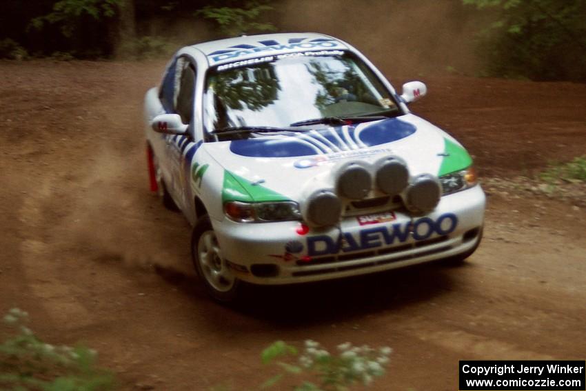 Peter Malaszuk / Darek Szerejko Daewoo Nubira powers out of a hairpin on SS5, Thompson Point I.