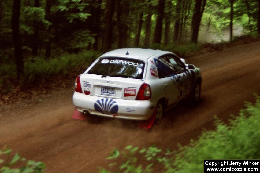 Peter Malaszuk / Darek Szerejko Daewoo Nubira powers out of a hairpin on SS5, Thompson Point I.