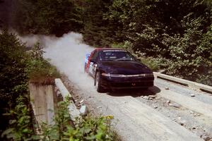 Cal Landau / Eric Marcus Mitsubishi Eclipse GSX at speed over a bridge on SS5, Magalloway North.