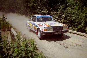 Bill Malik / Christian Edstrom Volvo 240 at speed over a bridge on SS5, Magalloway North.