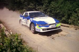 Celsus Donnelly / Kevin Mullan Eagle Talon TSi at speed over a bridge on SS5, Magalloway North.