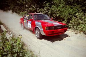 Sylvester Stepniewski / Adam Pelc Audi 4000 Quattro at speed over a bridge on SS5, Magalloway North.