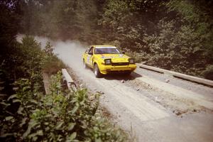 Bruno Laverdiere / Martin Duval Toyota Corolla at speed over a bridge on SS5, Magalloway North.