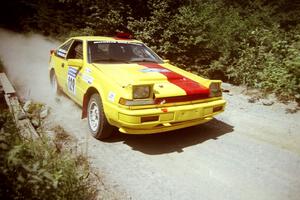 Scott Kreisler / John Bonasera Nissan 200SX at speed over a bridge on SS5, Magalloway North.