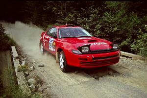 Michael Zamikhovsky / Ron Norton Toyota Celica GT-4 at speed over a bridge on SS5, Magalloway North.