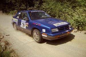 Kendall Russell / John Dillon Dodge Shadow at speed over a bridge on SS5, Magalloway North.