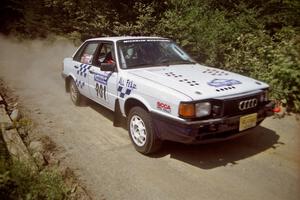 Gerry Brinkman / Will Sekella Audi 4000 Quattro at speed over a bridge on SS5, Magalloway North.