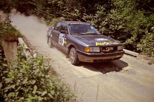 Jerry Cuffe / Barry Cuffe Audi 80 Quattro at speed over a bridge on SS5, Magalloway North.