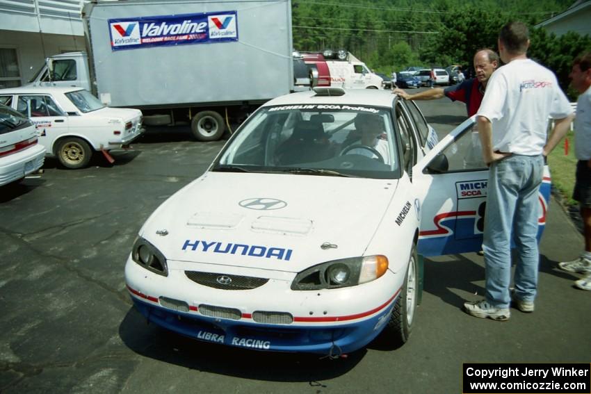 David Summerbell / Jeff Becker Hyundai Elantra is towed into the HQ lot after losing a transmission on the practice stage.