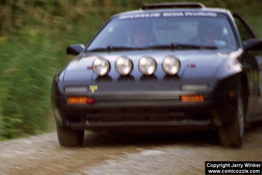 Jens Larsen / Roger Sanderson Mazda RX-7 at speed on SS3, Grafton I.