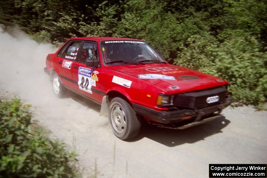 Jon Kemp / Rod Hendricksen Audi 4000 Quattro at speed over a bridge on SS5, Magalloway North.