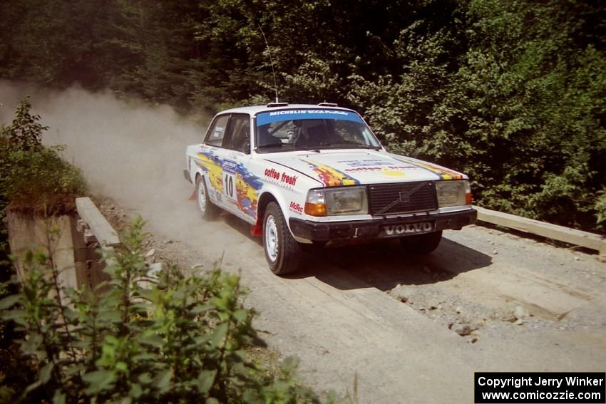 Bill Malik / Christian Edstrom Volvo 240 at speed over a bridge on SS5, Magalloway North.