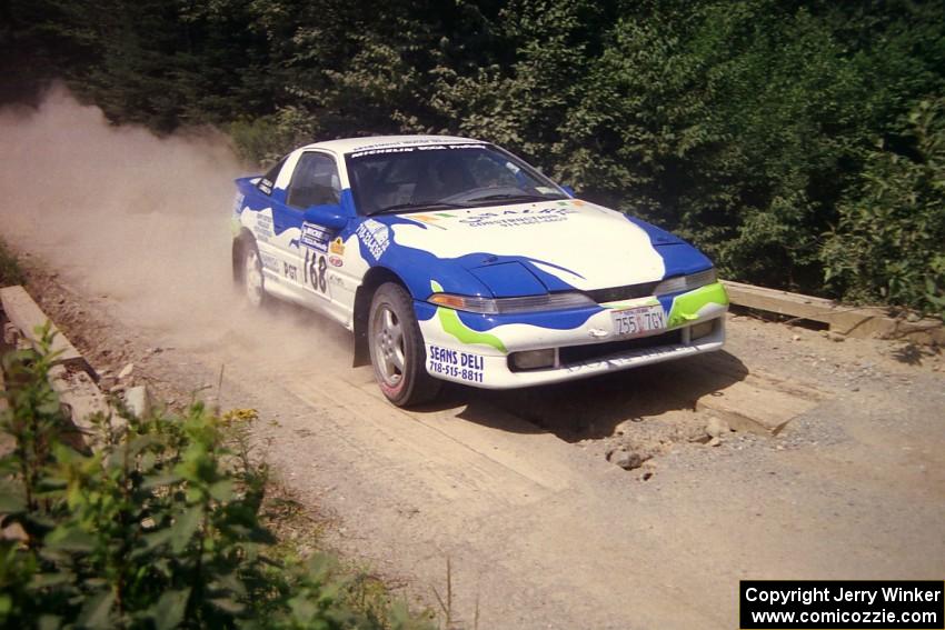 Celsus Donnelly / Kevin Mullan Eagle Talon TSi at speed over a bridge on SS5, Magalloway North.