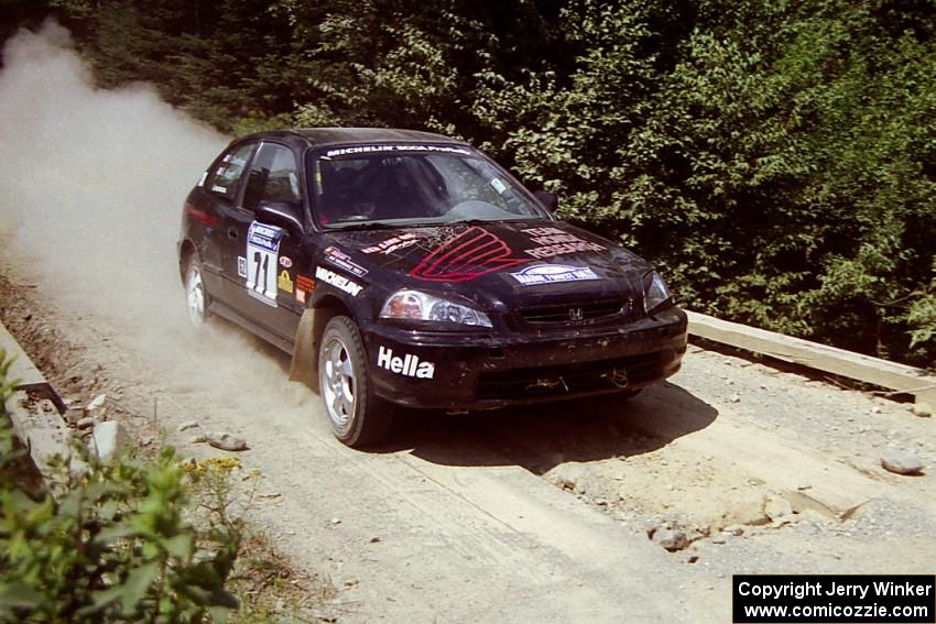 Bryan Hourt / Pete Cardimen Honda Civic at speed over a bridge on SS5, Magalloway North.