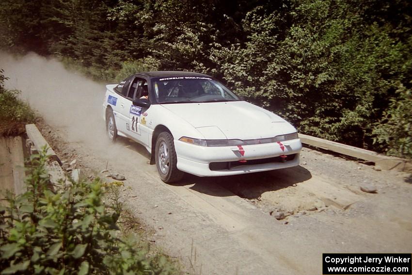 Chris Czyzio / Eric Carlson Mitsubishi Eclipse GSX at speed over a bridge on SS5, Magalloway North.