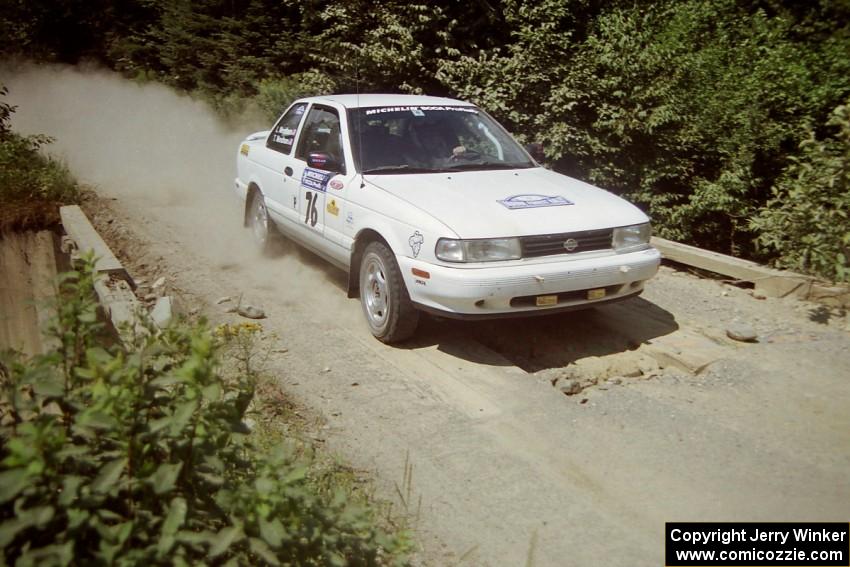 Ted Mendham / Lise Mendham Nissan Sentra SE-R at speed over a bridge on SS5, Magalloway North.