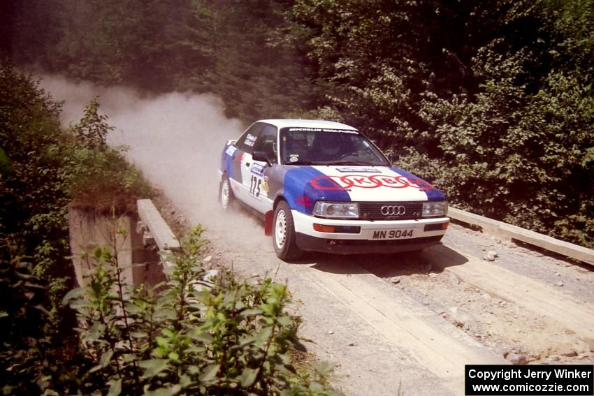 Alex Erisoty / Ben Greisler Audi 90 Quattro at speed over a bridge on SS5, Magalloway North.