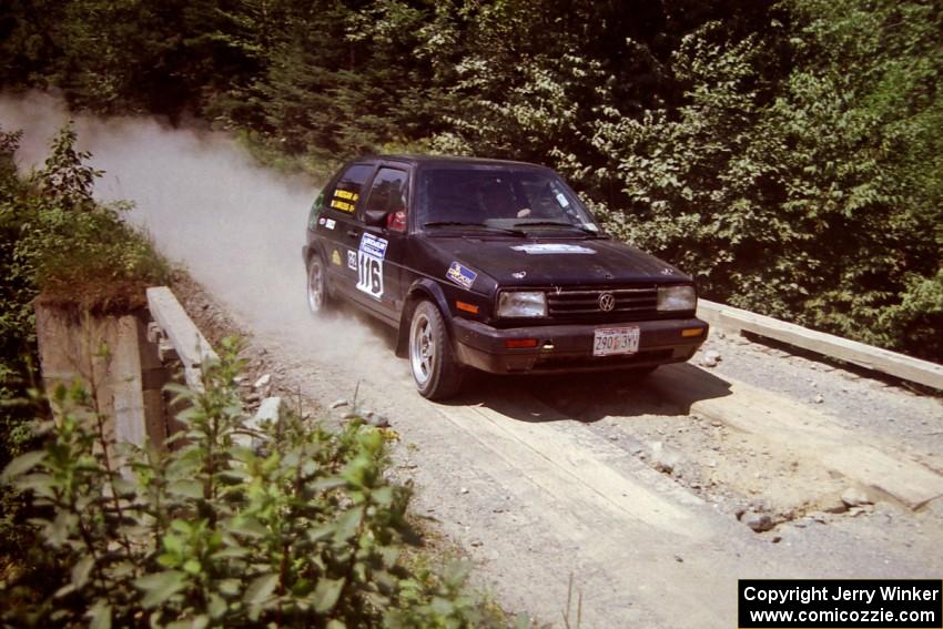 Tom Lawless / Brendan Lawless VW GTI at speed over a bridge on SS5, Magalloway North.