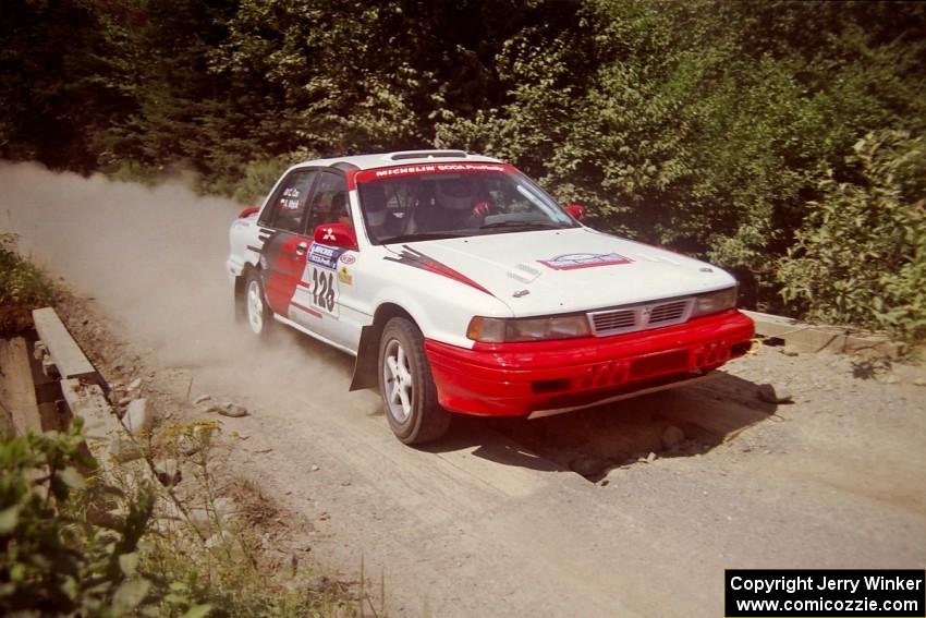 Arthur Wojcik / Chuck Cox Mitsubishi Galant VR-4 at speed over a bridge on SS5, Magalloway North.