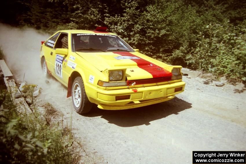 Scott Kreisler / John Bonasera Nissan 200SX at speed over a bridge on SS5, Magalloway North.