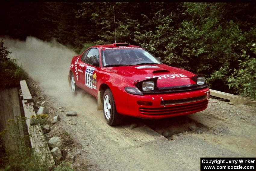 Michael Zamikhovsky / Ron Norton Toyota Celica GT-4 at speed over a bridge on SS5, Magalloway North.