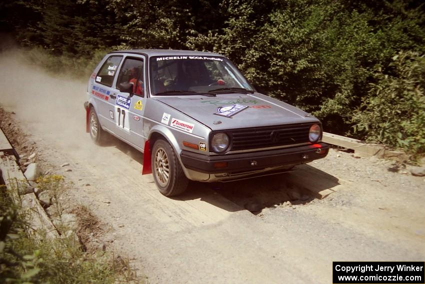 Robert Pao / Bob Barrall  VW GTI at speed over a bridge on SS5, Magalloway North.